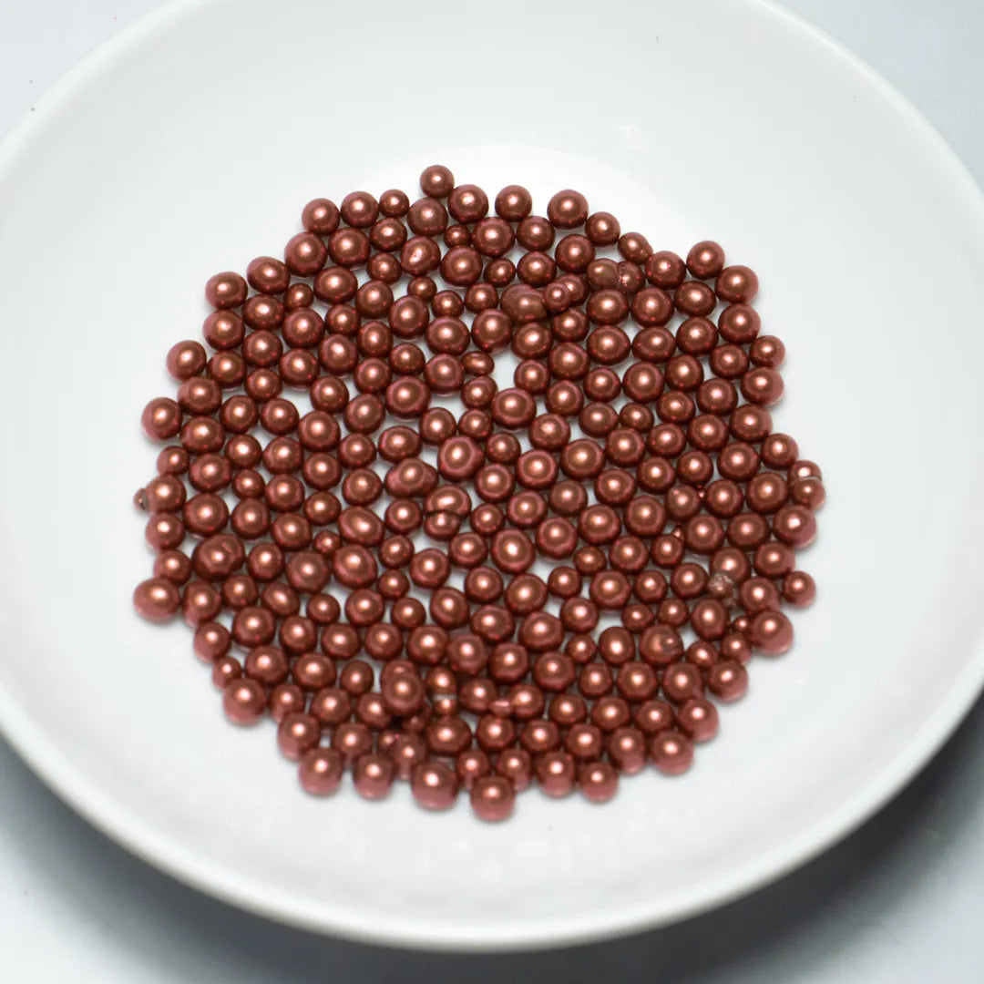 Grageas comestibles coloridas en paquete de 50g para decoración de tortas, cupcakes y galletas. Variedad de colores y tamaños para repostería profesional.