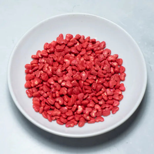 Grageas comestibles coloridas en paquete de 50g para decoración de tortas, cupcakes y galletas. Variedad de colores y tamaños para repostería profesional.