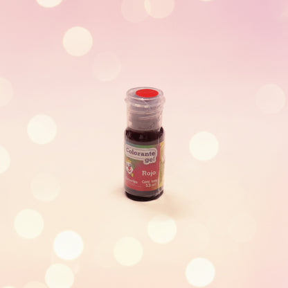 Colorante en gel Colorisa color rojo en frasco dosificador 13 gr con fondo bokeh rosado – colorante comestible para repostería - Vallia Reposteria