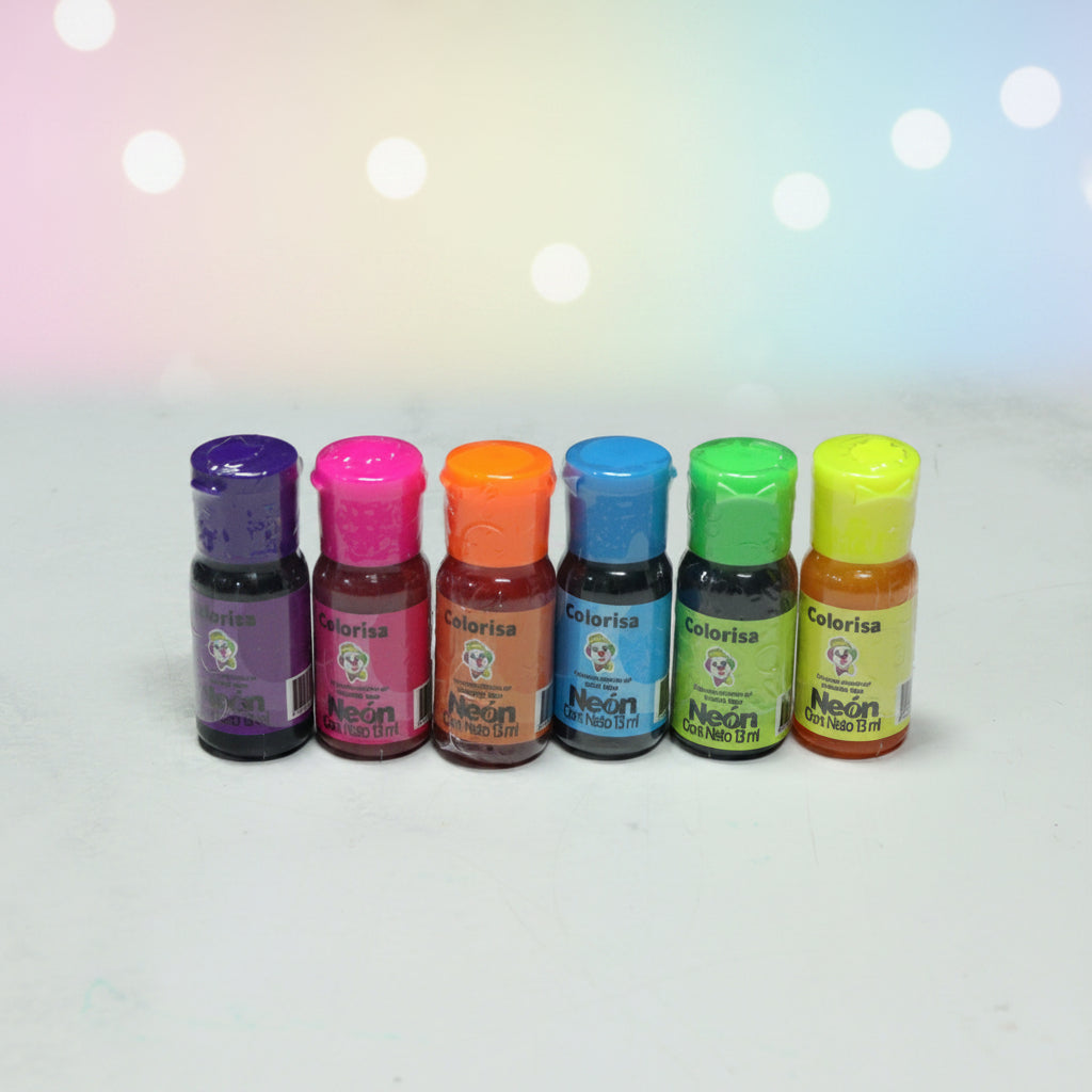 Colorante en gel neón Colorisa en frasco dosificador 13 ml sobre fondo mármol blanco – colorante para fondant y merengues - Vallia Reposteria