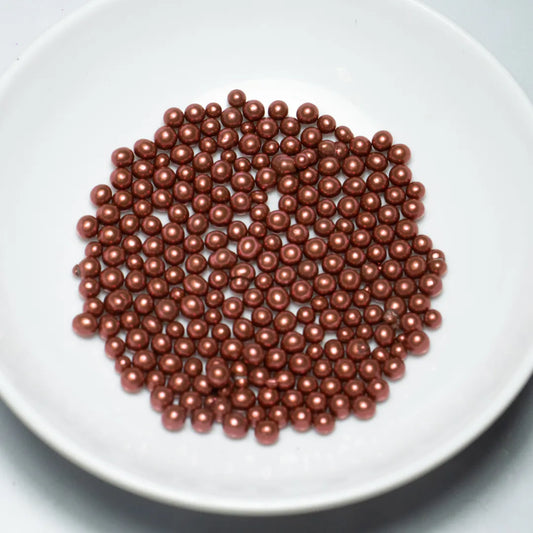 Grageas comestibles coloridas en paquete de 50g para decoración de tortas, cupcakes y galletas. Variedad de colores y tamaños para repostería profesional.