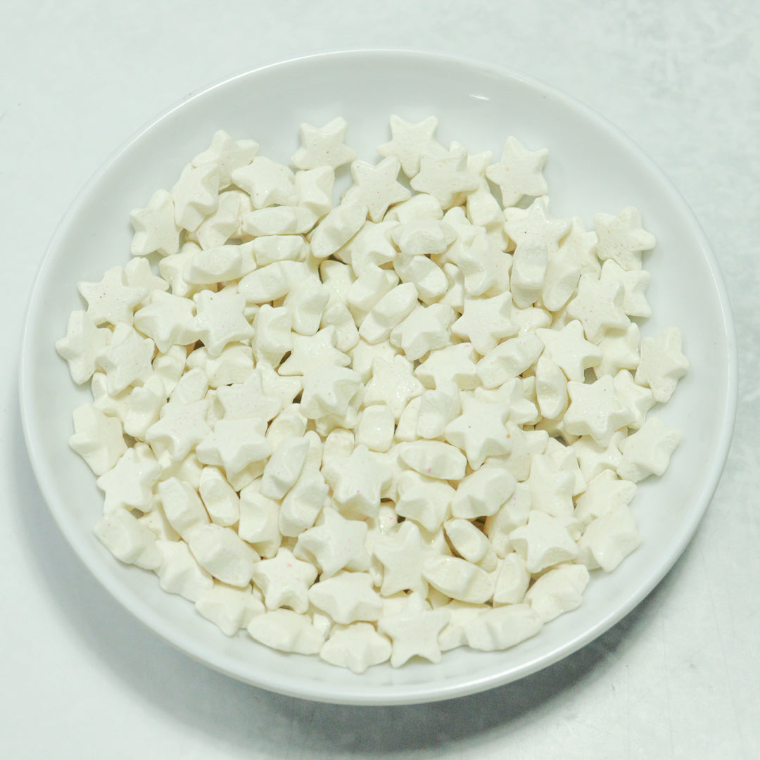 Grageas comestibles coloridas en paquete de 50g para decoración de tortas, cupcakes y galletas. Variedad de colores y tamaños para repostería profesional.