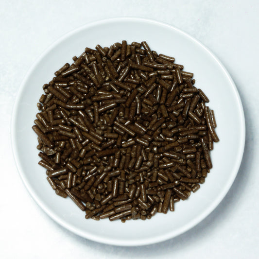 Grageas comestibles coloridas en paquete de 50g para decoración de tortas, cupcakes y galletas. Variedad de colores y tamaños para repostería profesional.