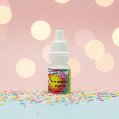 Colorante líquido hidrosoluble Colorisa color blanco en frasco gotero sobre fondo rosa con sprinkles – colorante comestible para repostería - Vallia Reposteria