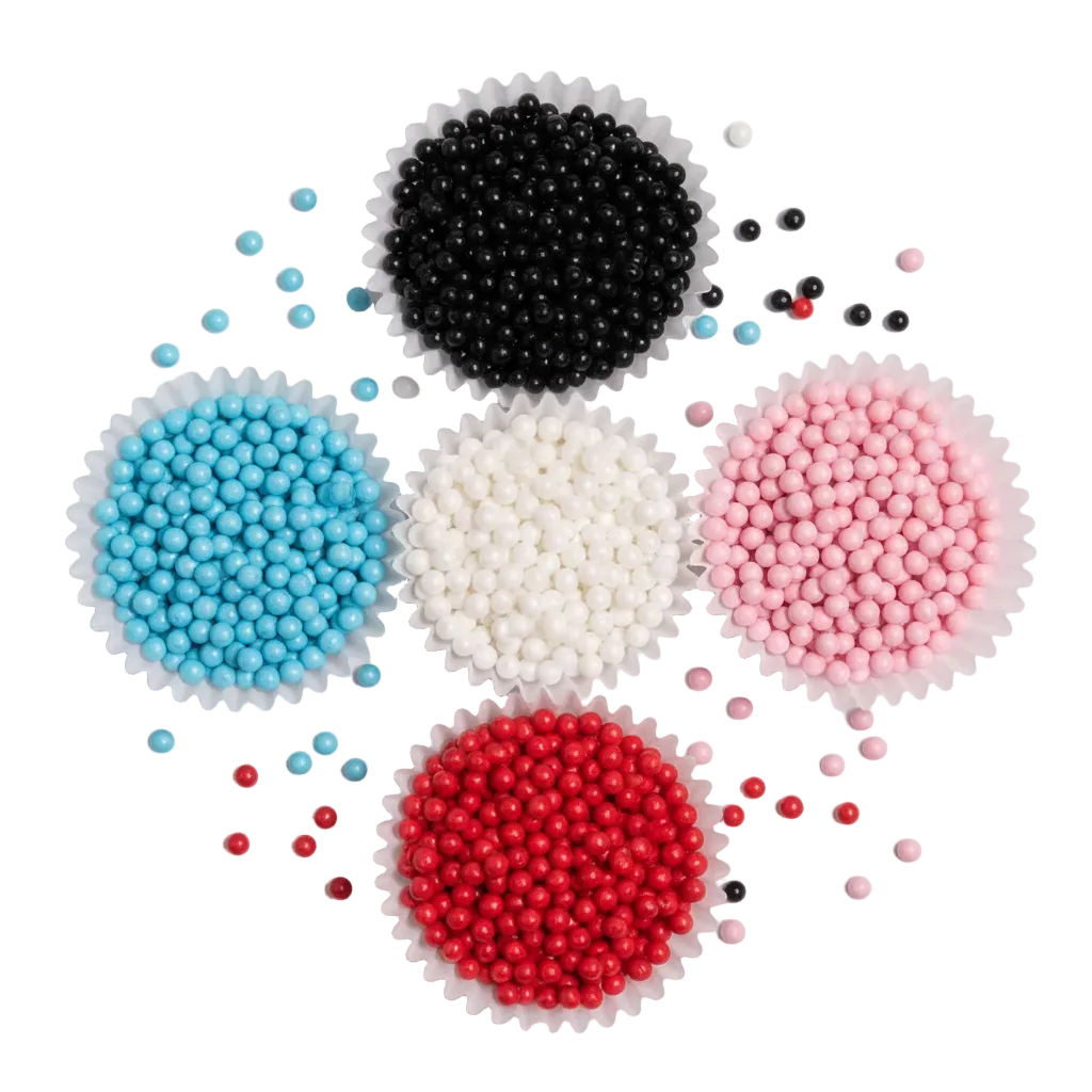 Capacillos con grageas perladas comestibles de Vallia Repostería en azul, negra, blanca, rosada y roja