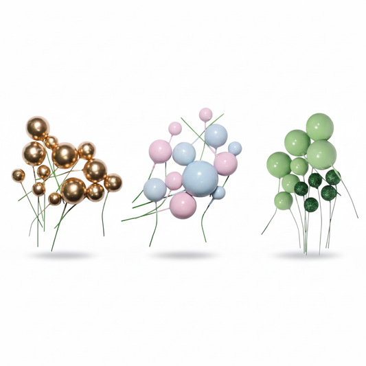 Portada del set de esferas decorativas de espuma de Vallia Repostería: composición de esferas rosadas, doradas y verdes con palito sobre fondo blanco.
