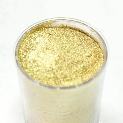 Vallia Repostería edible gold shimmer dust in a 10g jar with fine metallic texture for cake and chocolate decoration.