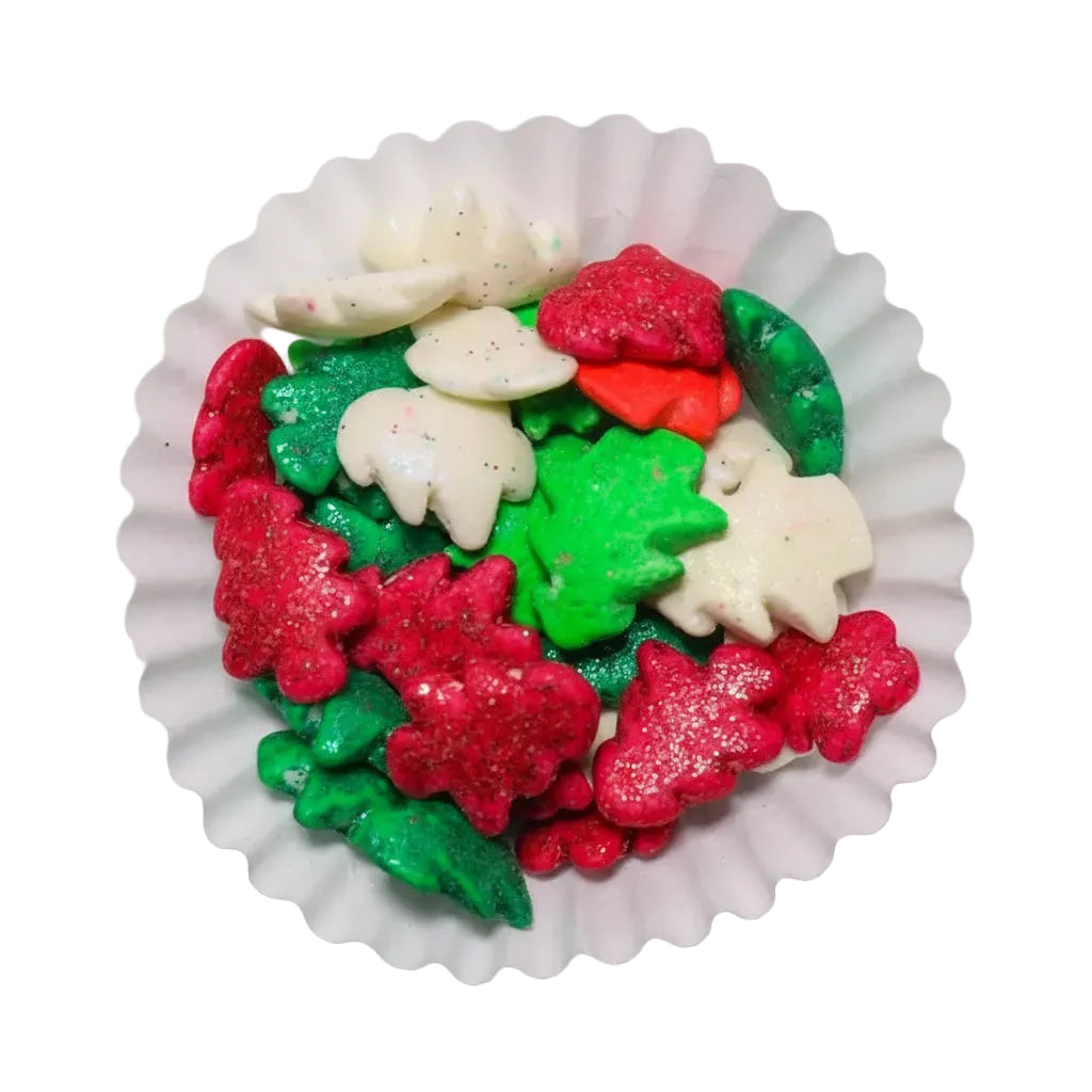 Gragea Navideña de Vallia Repostería con formas de árboles en colores rojo, verde y blanco con acabado brillante