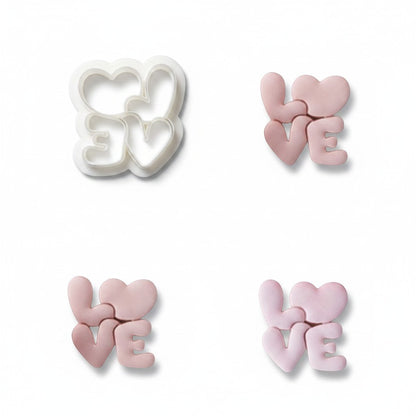 Molde de silicona Vallia Repostería con cortador blanco y figuras de fondant rosa con diseño de corazones y palabra LOVE