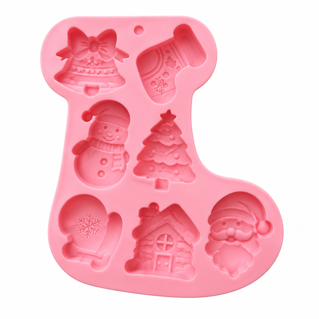 Moldes de silicona rosa Vallia Repostería con formas navideñas para chocolates y galletas sobre mesa blanca