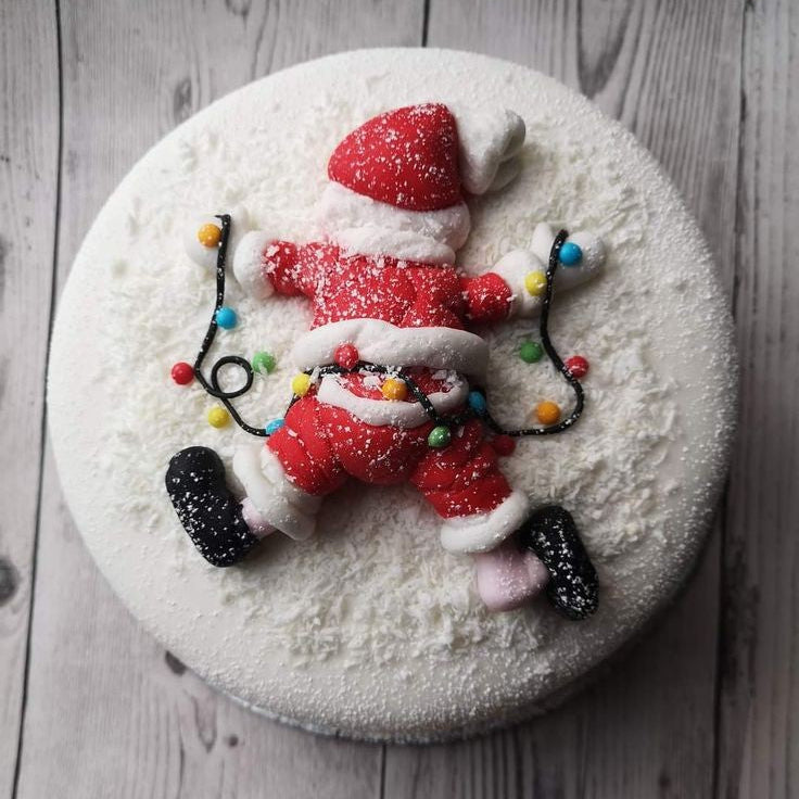 Molde de silicona Vallia Repostería para figura de Papá Noel caído en la nieve, ideal para decorar tortas navideñas.