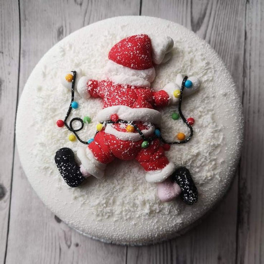Molde de silicona Vallia Repostería para figura de Papá Noel caído en la nieve, ideal para decorar tortas navideñas.