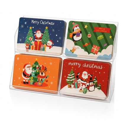 Set de tarjetas navideñas Vallia Repostería con diseños de Santa, pingüinos y renos en expositor acrílico transparente